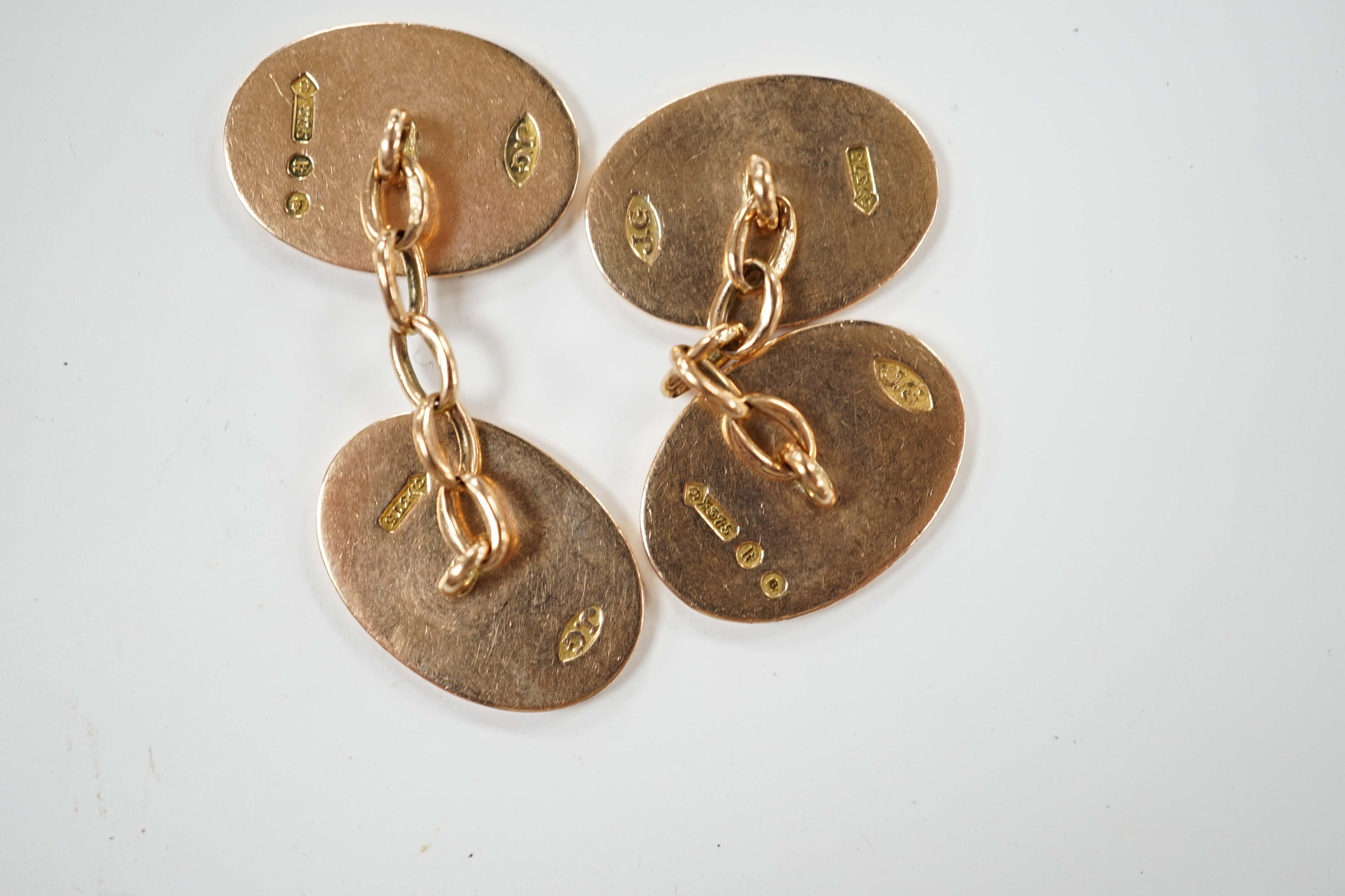 A pair of George V 9ct gold oval cufflinks, with engraved monogram